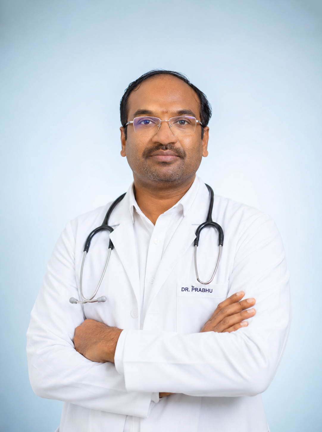 Dr. R. Bathri Narayanan in his white coat